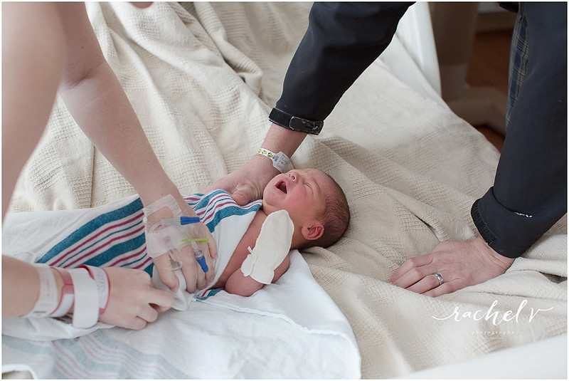 Brand new parents with their 1 day old baby
