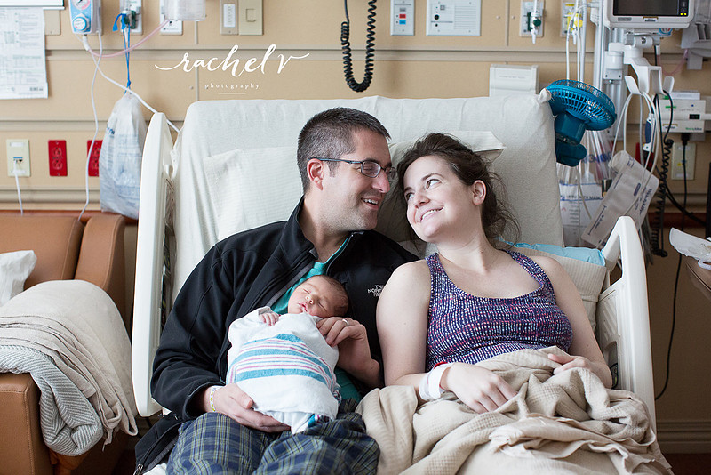 Brand new parents with their 1 day old baby