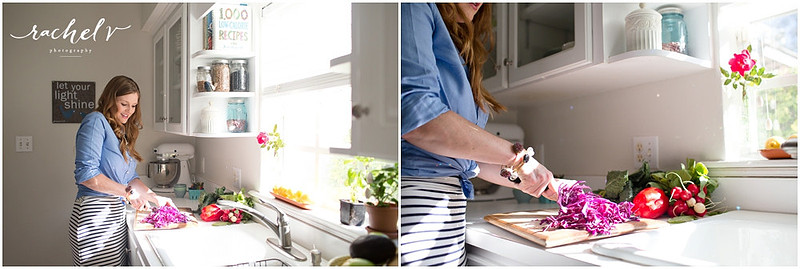 Woman in blue shirt chopping veggies in a brightly lit kitchen