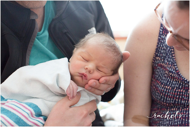 Brand new parents with their 1 day old baby